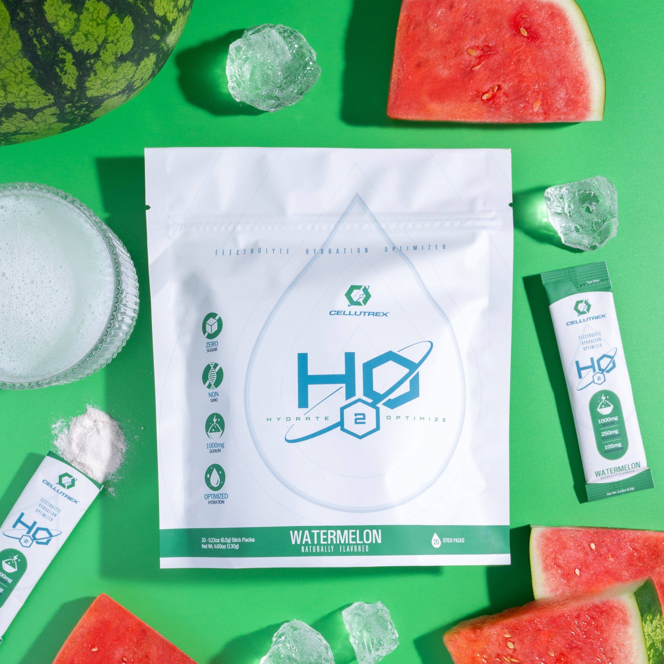 H2O Electrolytes™ Watermelon zero sugar electrolyte powder with fresh watermelon slices, ice cubes, and a fizzy mixed drink on a vibrant green background. Hydration packets for fast replenishment and optimal performance.
